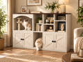 Double cat litter box enclosure in white and walnut with sisal scratching area, storage shelves and cats in a warm living room